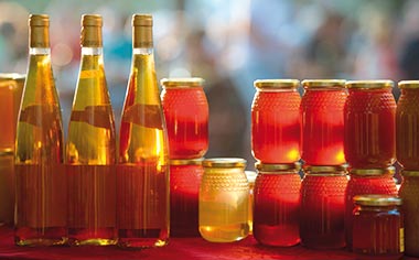 Jars of honey and bottles of honey wine
